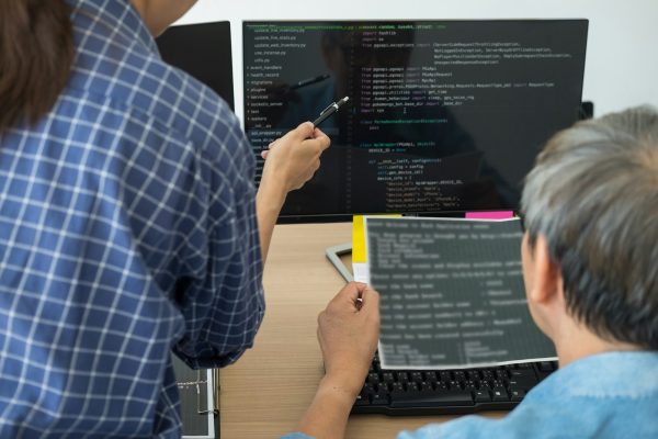 IT office Programmers software development coding technologies On Computer working in a company